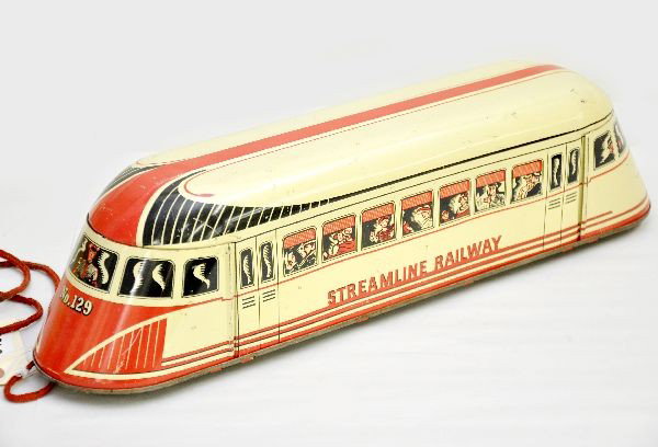 Nice Wolverine Interurban: Litho tin, 17" long, floor toy with original string, bright, clean and shiny showing light playwear to moderate playwear, C7-7+