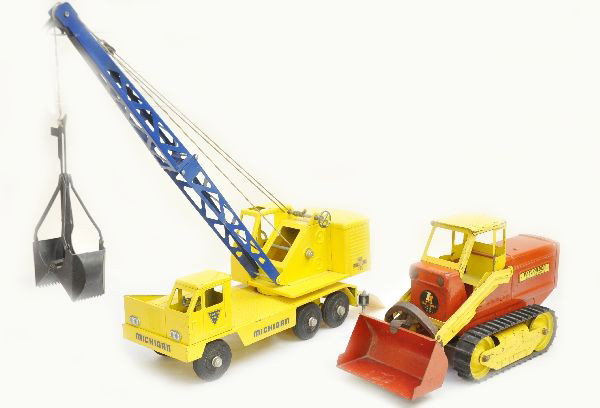 2 Ny-Lint Construction Trucks: Both are painted pressed steel, longest is 18" Michigan mobile crane which shows light to moderate playwear, C7; Unusual payloader tractor shovel with functional mechanism and original treads, missing
