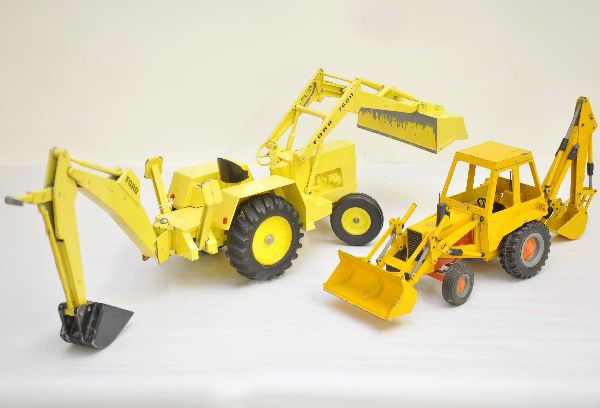 2 Scale Backhoes: Larger True Scale Ford 7600, 24" long painted die cast, under scoop shows wear; Gescha Case 580B Construction King. Both show moderate playwear, C6+