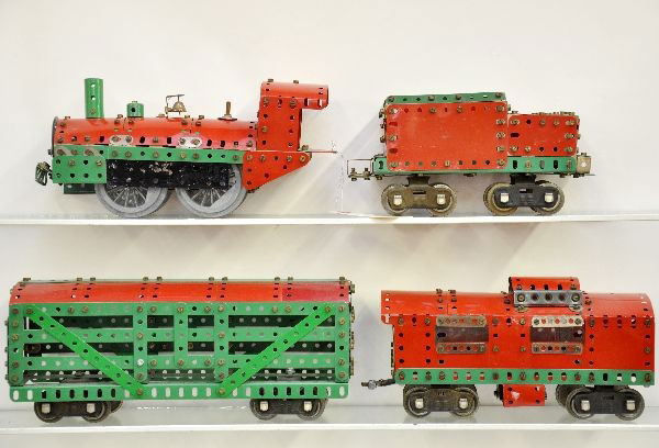 Unusual 4 pc Meccano Erector Train Set: Very unusual constructor toy set built-up into European style freight set, non-powered. Builder incorporated Lionel 500 Series trucks in standard gauge. Set is clean and shiny and shows light wear, C7