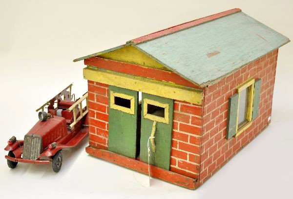 Fantastic Folk Art Garage: Wood construction with glass window, 14" x 21 1/2" x 13" with sliding doors, painted brick design, only one window has original glass. Wonderful look and scales well with pressed steel trucks (fire tr