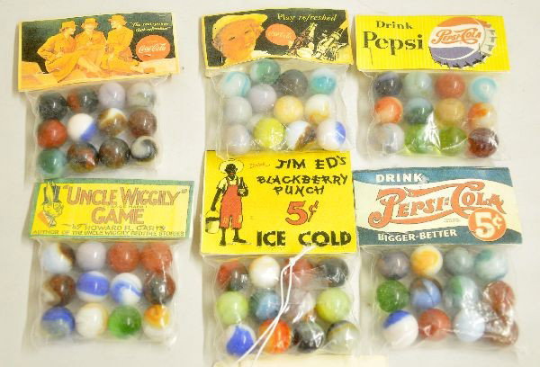 Unusual Lot of Advertising Marble Pks.: Includes 2 different Pepsi Cola, 2 different Coca-Cola, Jim Ed's Blackberry Punch and Uncle Wiggily Game. All are factory sealed C10