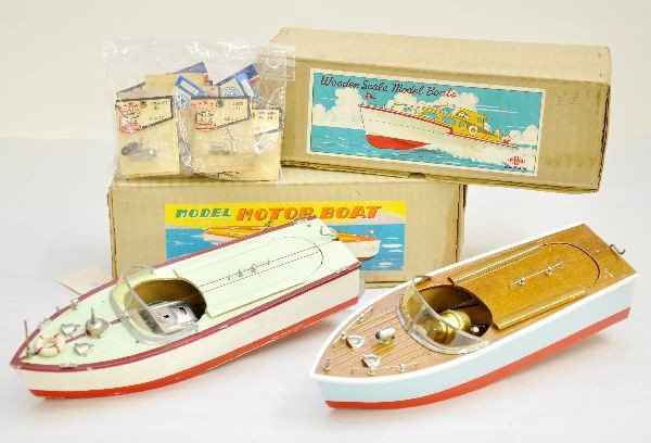 2 Boxed Japanese Wooden Boats Plus: HMM Japan & SW Japan, each are painted wood, battery operated, 11" long, one life preserver is loose, reed & white boat has some flaking to hull, missing flag and shows moderate playwear, C6 Plus, sev