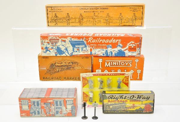 Boxed Early Figure Sets: S-Gauge. This unusual group includes carded Barclay miniatures (figures are C10, card is worn), 3 Lincoln Log sets, one in station box, Marx right-o-way signs, Minitoys street signs, H&H railroad mark