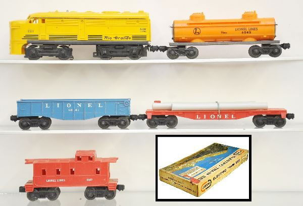 Boxed Lionel Set 19512: 221 Rio Grande Alco A diesel, 6045 tank car, unusual flat with white pipes, 6042 gondola, 6167 caboose, track and lock-on, original set box with inserts worn. Trains show light to moderate playwear, C