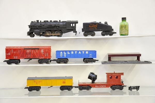 Marx Steam Freight Set: 1666 steam loco with smoking cylinders, missing trailing trucks screw; tender, operating stock car with boxcar platform, gondola, Air Force Missile launcher with activator, rocket worn; Allstate searc