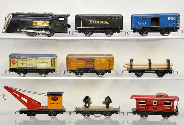 Marx Steam Freight Set: Commodore Vanderbilt loco, tender, reefer, copper searchlight, C&NW boxcar, B&O boxcar, wrecker, flat with logs, caboose. All show moderate playwear, C6-7