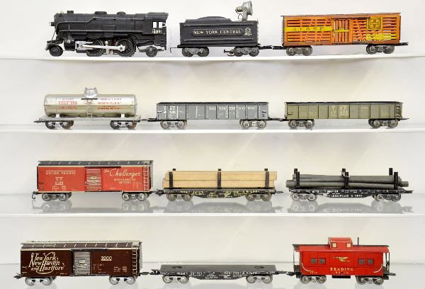Marx Scale Freight Set: 999 steam loco, wedge tender with searchlight, tank car, B&O & T&P gondolas, 2 boxcars, stock car, B&M lumber car with missing plate, C&O pipe car, NYC flat, caboose. All show light playwear, C7+