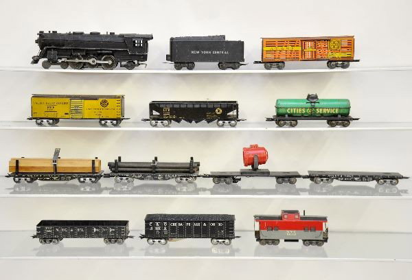 Marx Scale Freight Set: 333 cast Hudson with smoke, one wheel flange chipped; NYC cast tender, stock car, reefer, tank car, NKP flat, LV hopper, B&M pipe flat, NYC lumber car, searchlight car, high gondola with load, gondola
