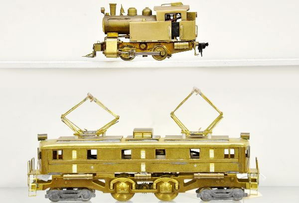 Brass HO Locomotives: 4-4-4 box cab electric, unpainted brass, appears complete. 0-4-0 tank loco also unpainted. Both show light playwear, C8