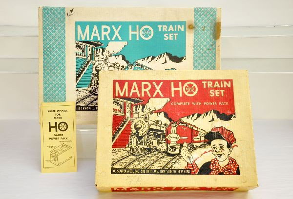 Boxed Marx HO Sets 64888 & 79542: 64888 includes an NYC GP7 and 5 freight cars, dozers missing treads, accessories track & transformer; Set 79542 includes Smoking Hudson with 3 cars, track & transformer, all show light to moderate pla