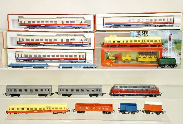 European HO Group: Includes Jouef Amtrak Streamliner in boxes; Boxed Tri-ang Stephenson's Rocket; Marklin 3021 plus several other miscellaneous pieces, some showing damage. Overall shows light to moderate playwear. C6-8
