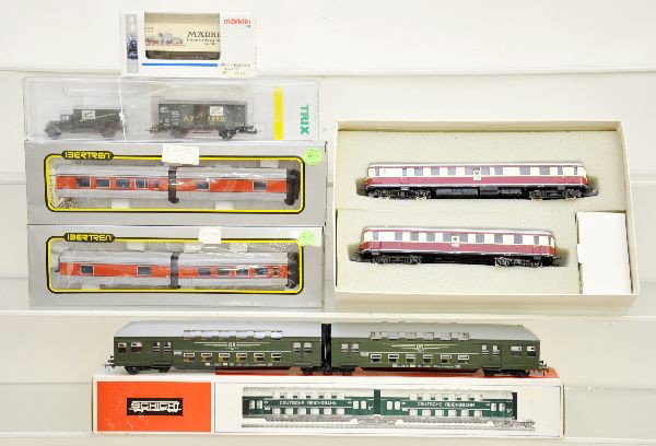 European HO Trains: Piko 5/0732/011 German Interurban with trail car, 2 Schicht double level commuter car sets, each having two cars; Bertren 2 pair of Talgo coaches, lighted; Trix AW Faber goods wagon & truck set; Markl