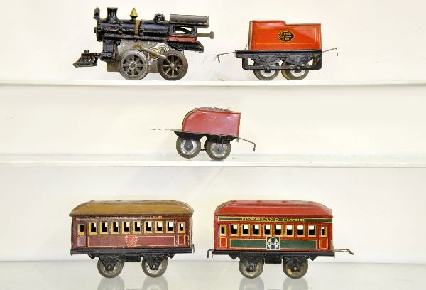 Early Hafner Train Set: Cast loco, motor non-functional with key, missing coupler pin; scarce Bell tender & NYC tender; SF Coach & PRR Coach, all show moderate playwear, C6-