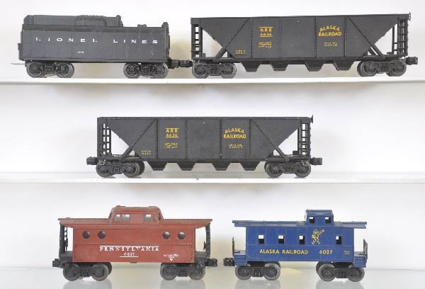 5 Lionel Freight Cars: 234W Tender, 2 broken steps; 2 #6636 Alaska Quad hoppers, 1 has spreader bar; 6437 PRR Caboose & 6027 Alaska Caboose, otherwise all show moderate playwear, C6-7