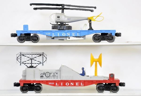 Lionel 3419 & 3540 Space Cars: 3419 helicopter car, large winder with double bladed copter, separation on tail loop; 3540 radar car, both otherwise show light playwear, C7+