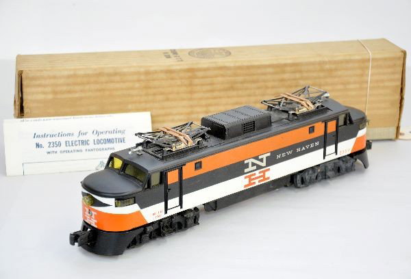 Scarce Boxed Lionel 2350 NH EP-5: Nice first production 1956 EP-5 electric with painted nose graphics. Hairline rivet cracks both sides, but clean, instructions and a nice ob, otherwise C7+