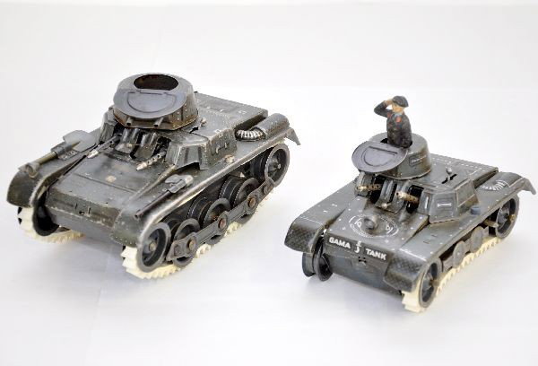 2 Gama German Tin Tanks: Litho tin, mechanisms are functional, missing 1 tread. Largest is 7 1/2", includes 1 composition Panzer soldier. Both show light to moderate playwear, C7