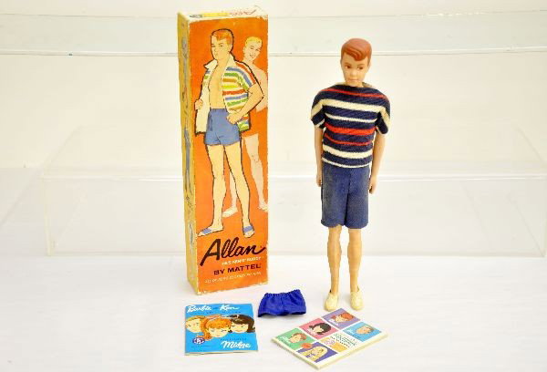 Unusual Boxed Mattel Allen Doll: 1963 Barbie's companion Ken's Buddy. Shows light soiling with extra shorts and 2 catalogs. Otherwise shows light to moderate playwear with nice original box, C7