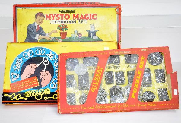 AC Gilbert Magic & Puzzle Lot: Includes two #1032 Puzzle sets, missing 1 piece, two different boxes, both worn; #1 Mysto Magic Exhibition Set which appears fairly complete with instruction. Examine photos. Otherwise C8
