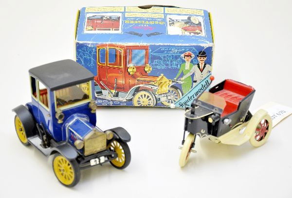 Two German Toy Vehicles: Schuco 1236 1917 Ford coupe, mechanism functional with key; Tucher & Walther velocipede, litho tin lever action functional. Both show light playwear, some dust C7+