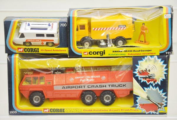 Boxed Corgi Vehicle Lot: 700 High-speed ambulance, 1117 Faun-AK435 road sweeper, 1103 Chubb Pathfinder airport crash fire truck. All have original boxes with worn display inserts, toys are C9
