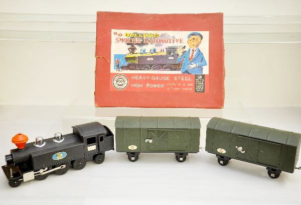 Boxed SAN Steel Smoking Train Set: Unusually heavy gauge steel set, including 1 gauge size battery tank loco, missing battery box cover; 2 Goods Wagons, otherwise appear like new with 3 set boxes, C8