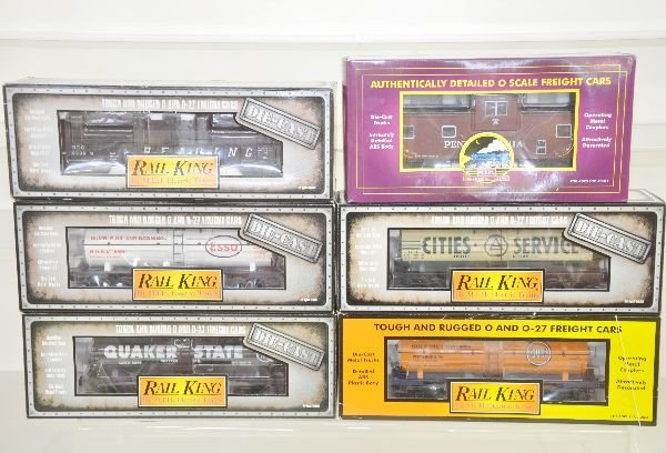 6 MTH Freight Cars: Diecast Tank Cars- 30-8119 CS; 8116 Quaker State; 8110 Esso; 8204 Reading diecast gondola; 20-9168 PRR Caboose; 30-7377 Gulf Tank, all unrun, obs C9