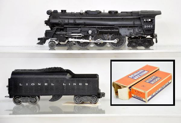 Boxed Lionel 2065 Steam Locomotive: Clean with heat stamped cab lettering, 1 front step is missing, but it has a nice 2046W whistling tender, both show light to moderate playwear with their obs and inserts, missing 1 flap, otherwise C6+