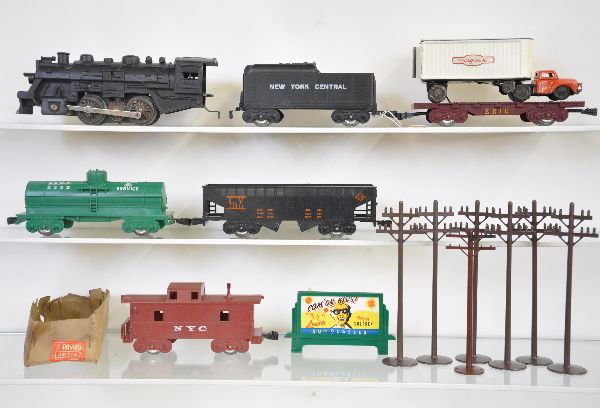 Marx Walgreens Special Train Set: 400 Loco; tender; tank car; hopper, scarce flat with Walgreens truck with box bottom; caboose & telephone poles, all show light playwear, C8