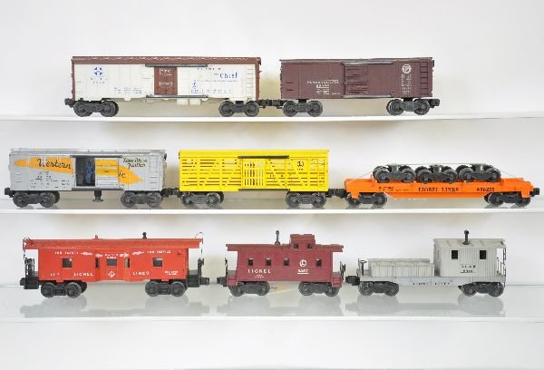 8 Lionel Freight Cars: 6362-55 truck car, used load; 6454 PRR boxcar; 6656 stock car; 6419 caboose; 6672 reefer; 6357-25 caboose; 6517 baywindow caboose; 3474 WP oper boxcar, decals 80%, otherwise all show light to moderate