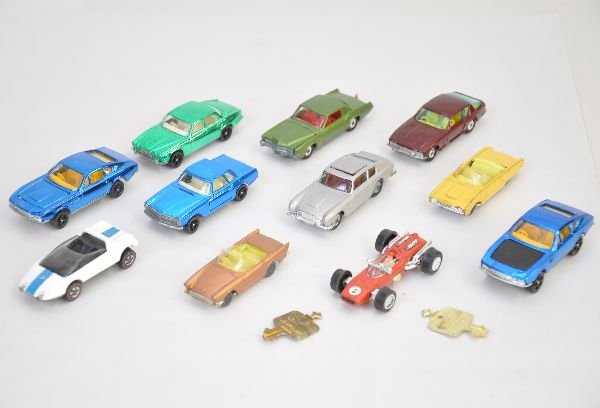 11 Pc Diecast Vehicle Lot: 4 Corgi Jr Rockets, 2 have keys; Corgi 007 Austin, missing man; Jensen & Eldorado; Husky T-Bird & Sunbeam, showing moderate playwear; Unusual Remco Racing Wheels Ferrari; Mattel Redline Hotwheels Jack