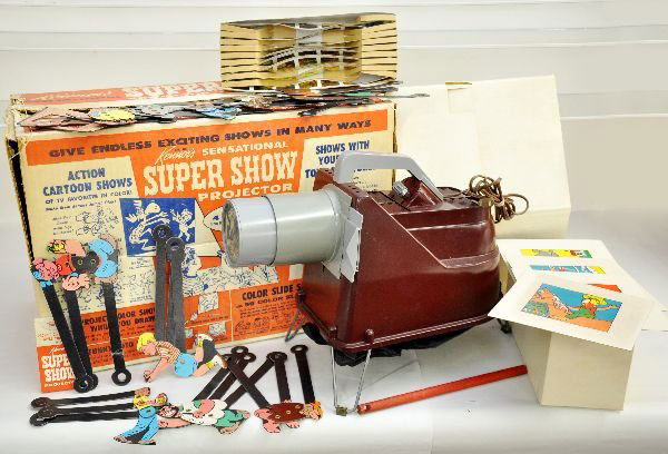 Boxed Kenner Super Show Projector: Dated 1962. Tough to find as nice as this example is, used, but contains 7 of its original 8 film strips, ob with inserts, showing light playwear, C7+-8
