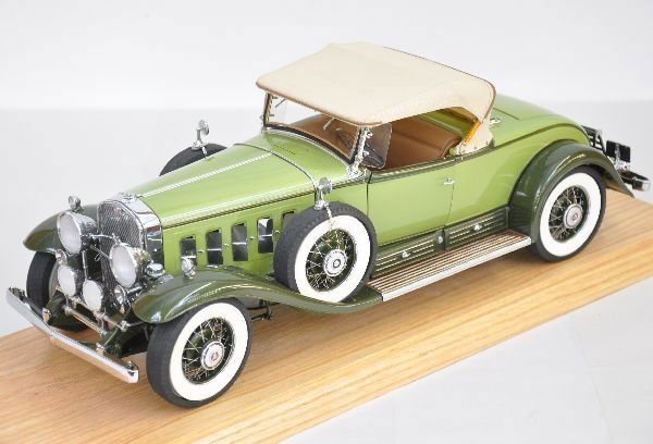 1:12 Danbury Mint 1933 Packard: This awesome connoisseur edition die cast scale model of the V16 is super detailed down to the leather interior and retractable top. It is 18" long and appears like new, in a custom display case (top