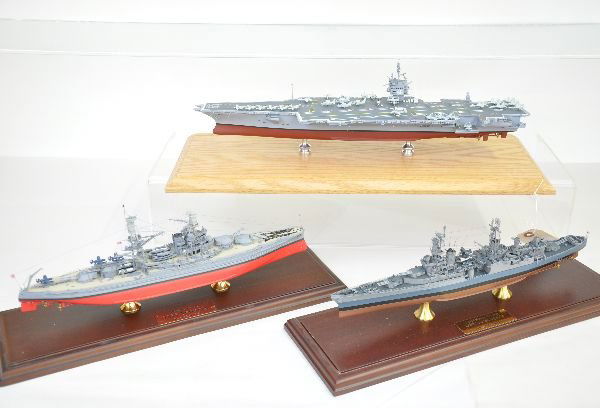 3 Scale Detailed Military Ships: Danbury Mint 1944 USS Indianapolis & 1941 USS Arizona, both die cast models with display case; Plus a 19" unidentified Aircraft Carrier (includes an AWAX plane on deck). Display case top is chipped, b