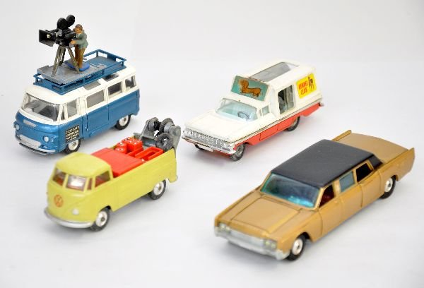 4 Corgi 1960s Vehicles: Includes Lincoln Continental, clean battery box; Kennel club with dogs; Comer 2500 bus with film crew & suitcase; VW Bus service truck with spare tire, all show light playwear and should clean to C7+-