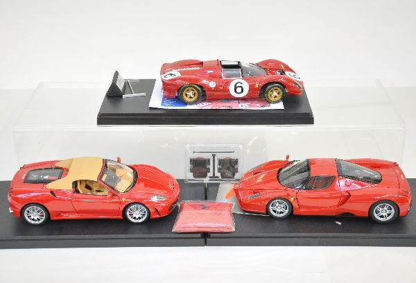 Three 1:18 Scale Ferrari Cars: Highly detailed diecast models, including GMP 1967 330/P4 Spyder; BBR F430 Coupe & Enzo with accessories. All otherwise all like new with AMT plastic display cases. C9