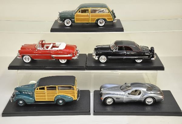 Five 1:18 Scale Automobiles: Highly detailed diecast models, including Maisto 1050 Ford; Motor City 1939 Chevy Master deluxe & 1949 Ford woody; Sun Star 1954 Belair Convertible;