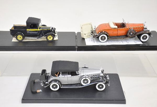 3 Danbury Mint 1:24 Scale Vehicles: Highly detailed diecast models, including 1932 Cadillac V-16 Cadillac Roadster; 1929 Dodge Pick-up; 1932 Cadillac V-16, all like new with AMT plastic display cases. C
