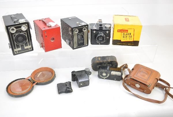 8 Pc Vintage Camera Lot: Includes an early 2pc lens set with worn case; Target Brownie six-16; Red #2 Brownie; Boxed Brownie Flash six-20; Univex model A; Weston 650 light meter; Whitehouse Beacon II camera; Brownie target si