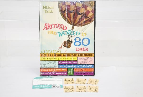 1957 Childrens Book & Theater Tickets: Around The World In 80 Days, by Michael Todd in nice condition. In addition there are 6 -1957 ticket stubs from the movie shown in the Rivoli Theater with its original envelope. Examine photos or call