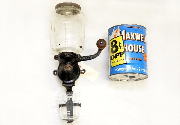 Early Coffee Grinder & Can: Parker Grinder, dated 1917 with original glass top, collecting cup & tin top; 1970s full Maxwell house can of coffee with key opener still attached to bottom.