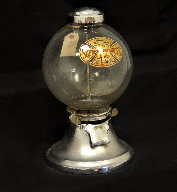 Early Appleton Gum Ball Machine: 9 X 15" metal & glass machine with nice original decal stating Supreme Products. Appleton Novelty Co, Cedar Rapids, IA. Functional, but no key for top pad lock. Shows light to moderate signs of use &