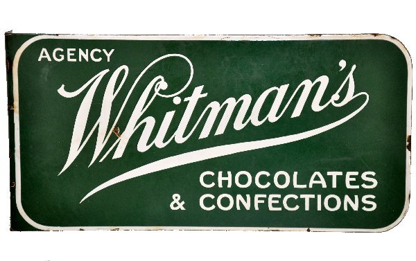 Whitman's Chocolates Flanged Metal Sign: 20 X 10" 2-color, 2-sided porcelain flanged sign. Clean & shiny, showing light to moderate signs of use & age. .