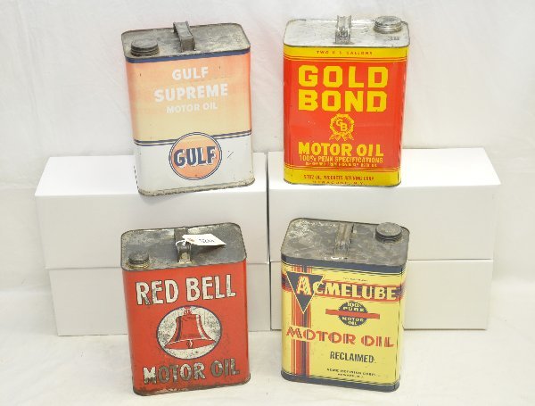 4- 1940s 2 Gal. Oil Cans: Includes Gold Bond; Gulf Supreme (faded 1 side); Red Bell (showing moderate wear), & Acmelube. All are fairly clean & shiny. .