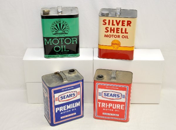 4- 1950s 2 Gal. Oil Cans: Includes Sears Premium & Tri-Pure, both missing tops; Eastern States (has small dents) & Shell Silver. All are clean & shiny, showing light to moderate wear. .