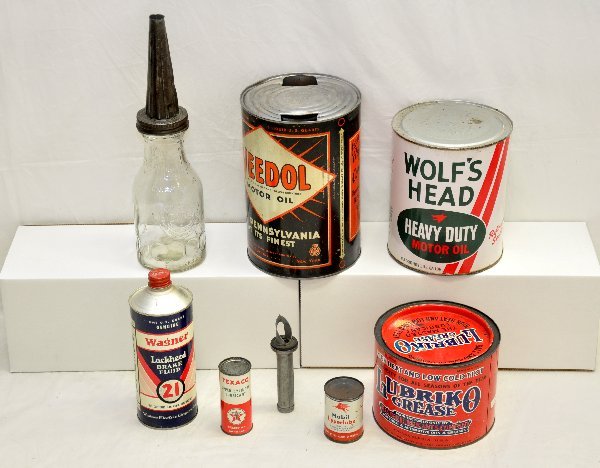 8 Vintage Oil & Lube Cans: Includes 1 gal Wolf's Head; 5 Qt Vedol; Texaco & Mobil upper-lubes (full); Wagner Brake fluid (full); Dover glass oil bottle with spout; Lubriko Grease can & an early puncture can spout. All show sign