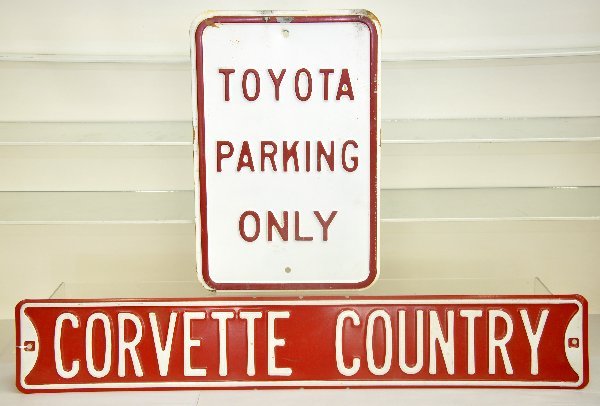 Toyota & Corvette Sign Lot: 12 X 18" Toyota Parking Only embossed metal sign, plus a 36 X 6" Corvette Country embossed metal sign, both are 2-color, 1-sided and show signs of use & age. .