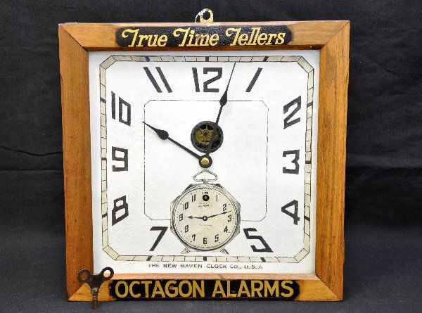 New Haven Clock Advertisement: A clock to advertise itself! 14 1/2 X 14 X 4 1/2 oak case with paper face. Face has been touched up extensively. Clock is functional, but not guaranteed, has key.