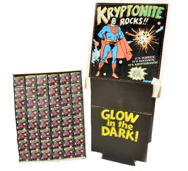 Superman Kryptonite Store Display: Circa 1977. Once assembled, stands approximately 68" tall. Includes cardboard base, product tray and header card. 48 boxes in the tray and each box contains one or more pieces of glow in the dark pain